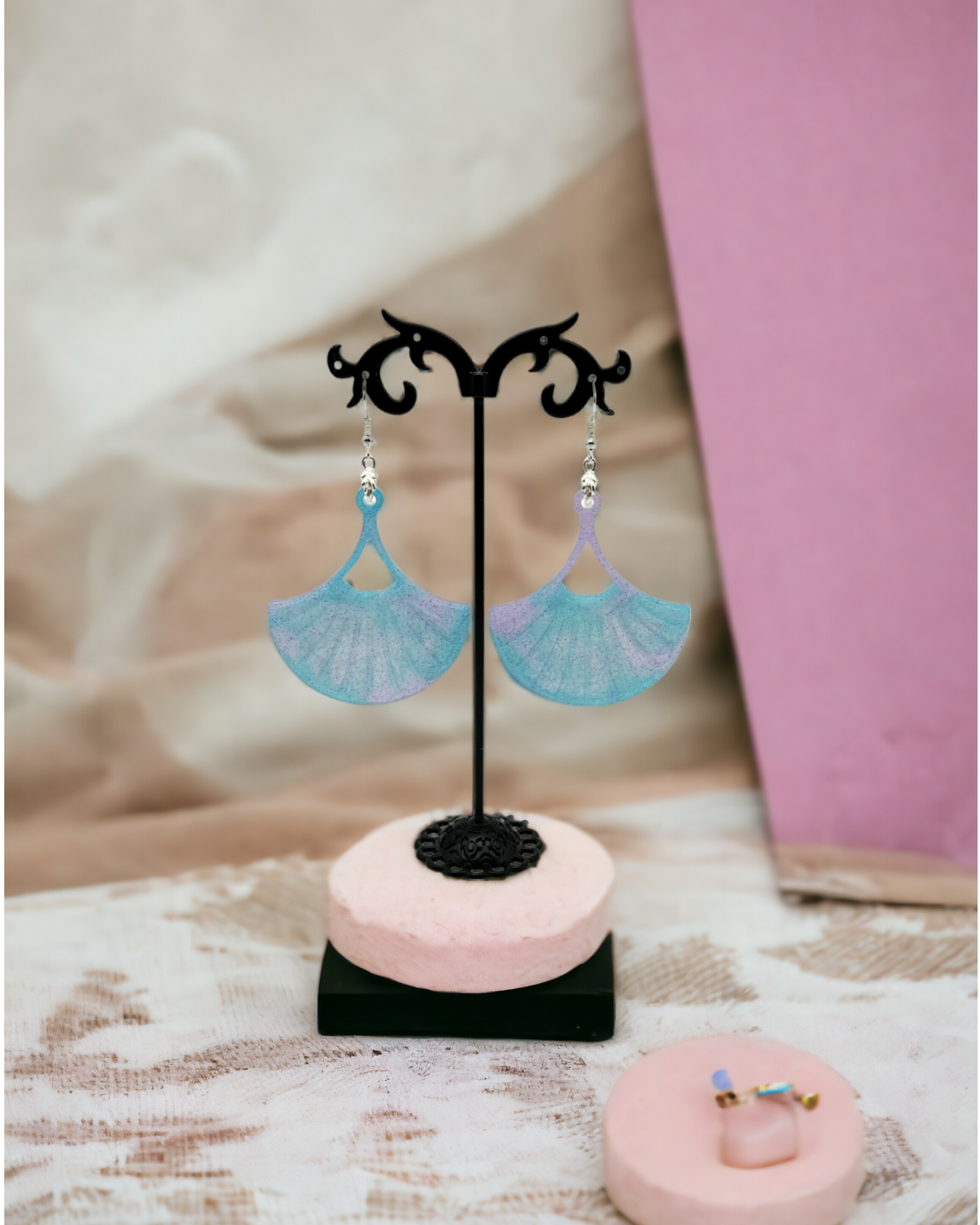 Large Fan Earrings with an Aqua and Light Purple Swirl Design